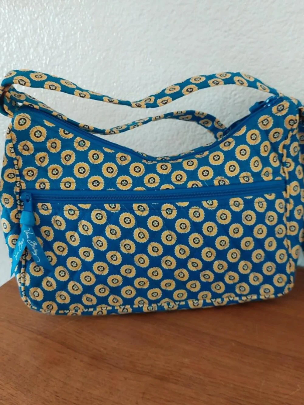 vera bradley rivera Blue and yellow circular patterned crossbody bag with adjust